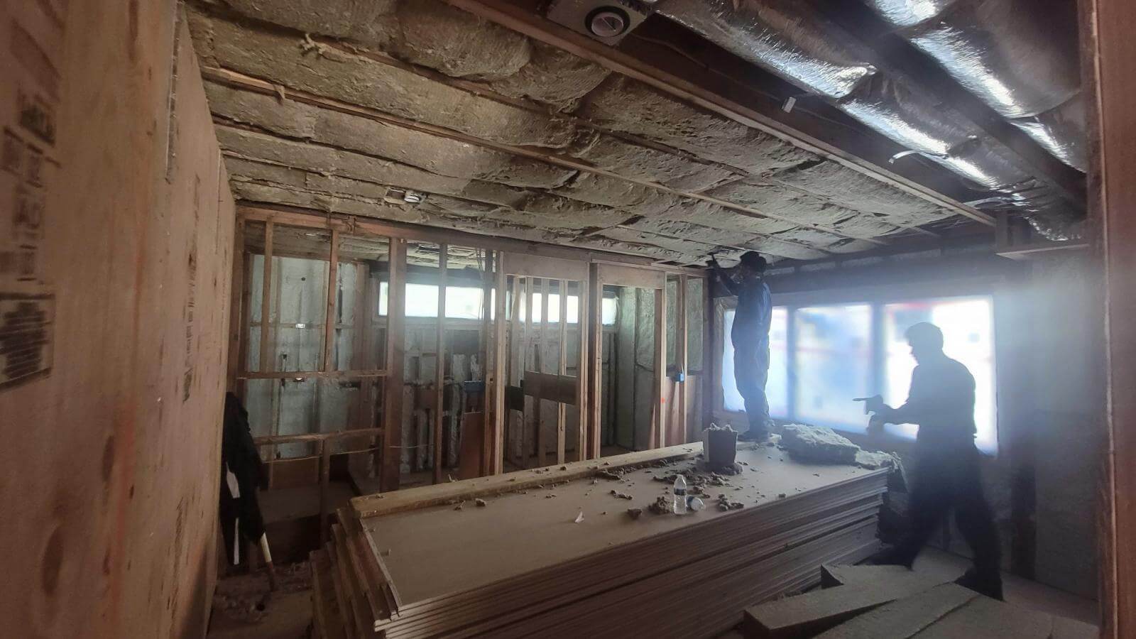 Open-cell spray foam soundproofing a home studio wall