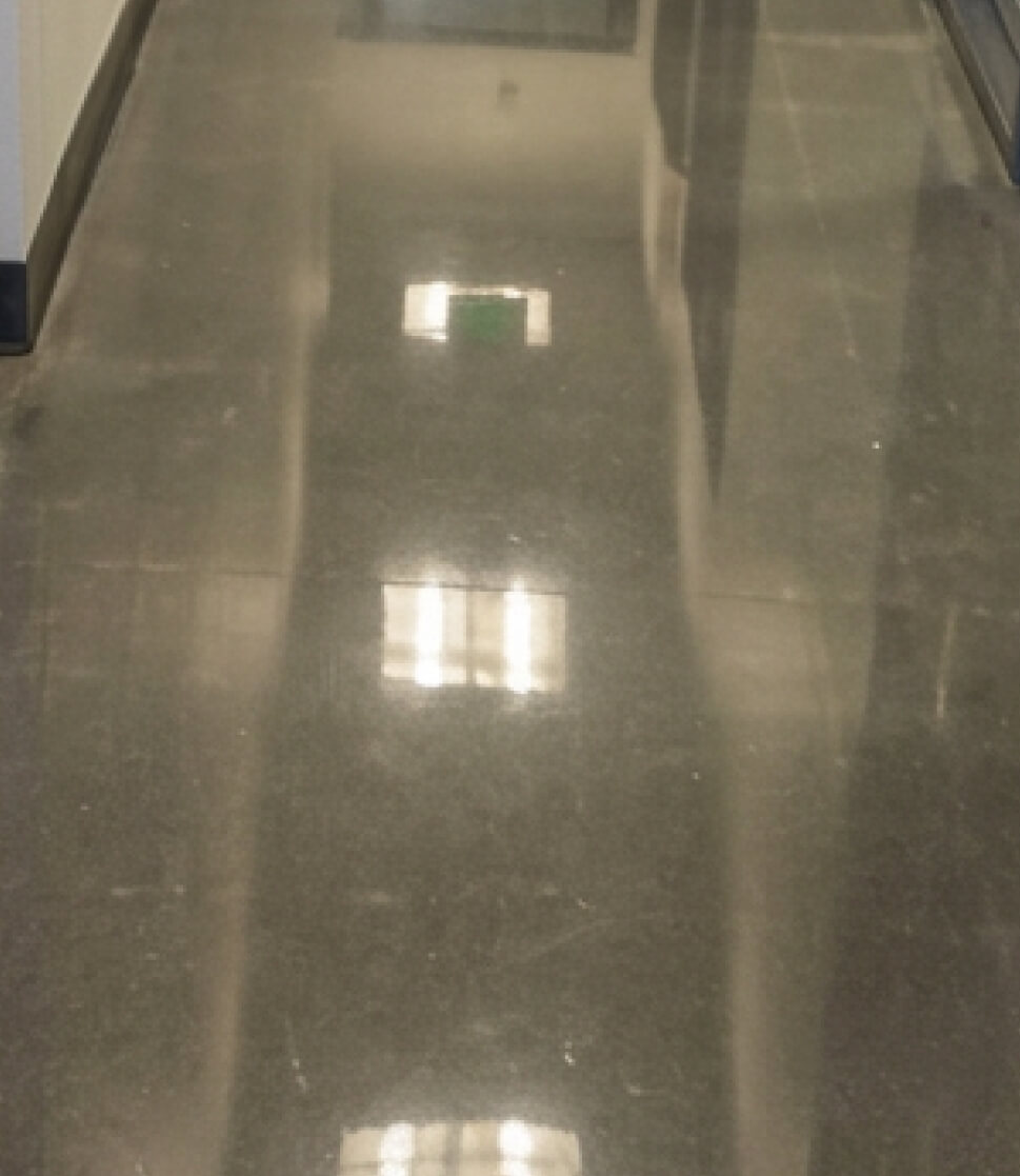 Diamond grinding a concrete floor before epoxy coating