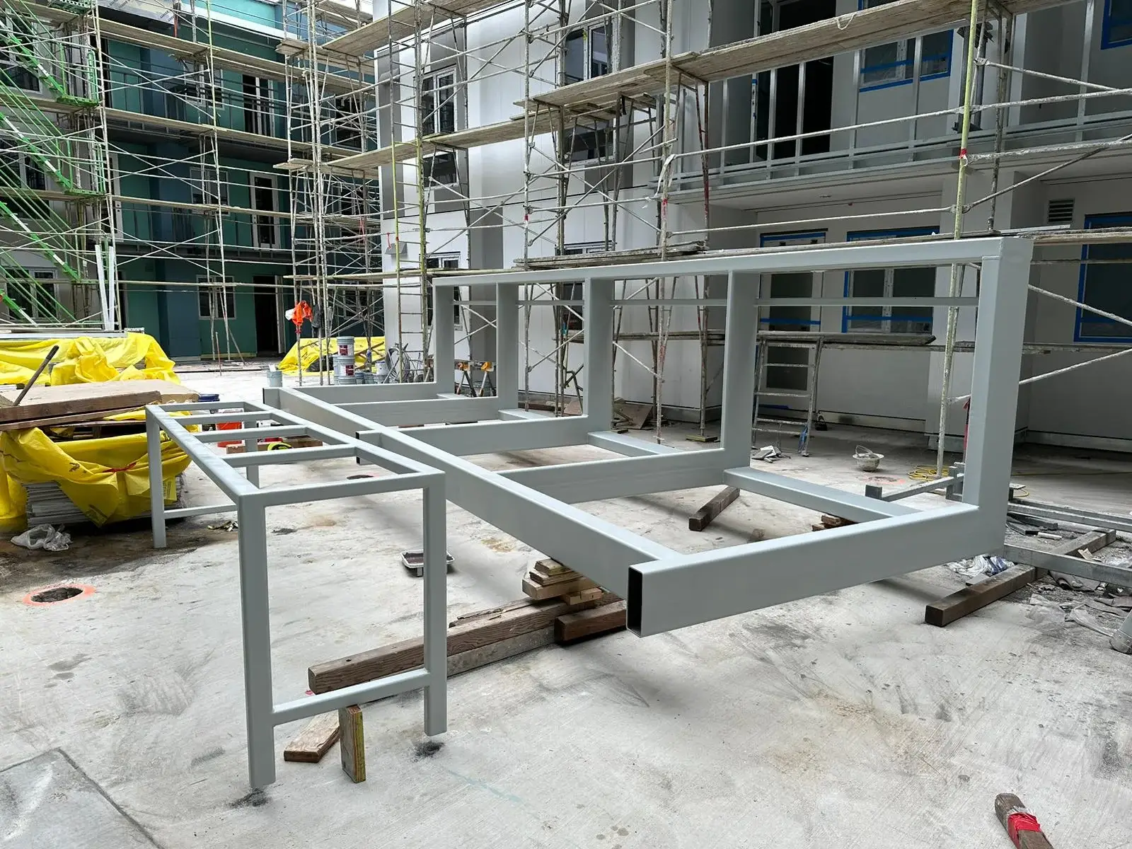 Industrial sandblasting and protective coating of structural steel