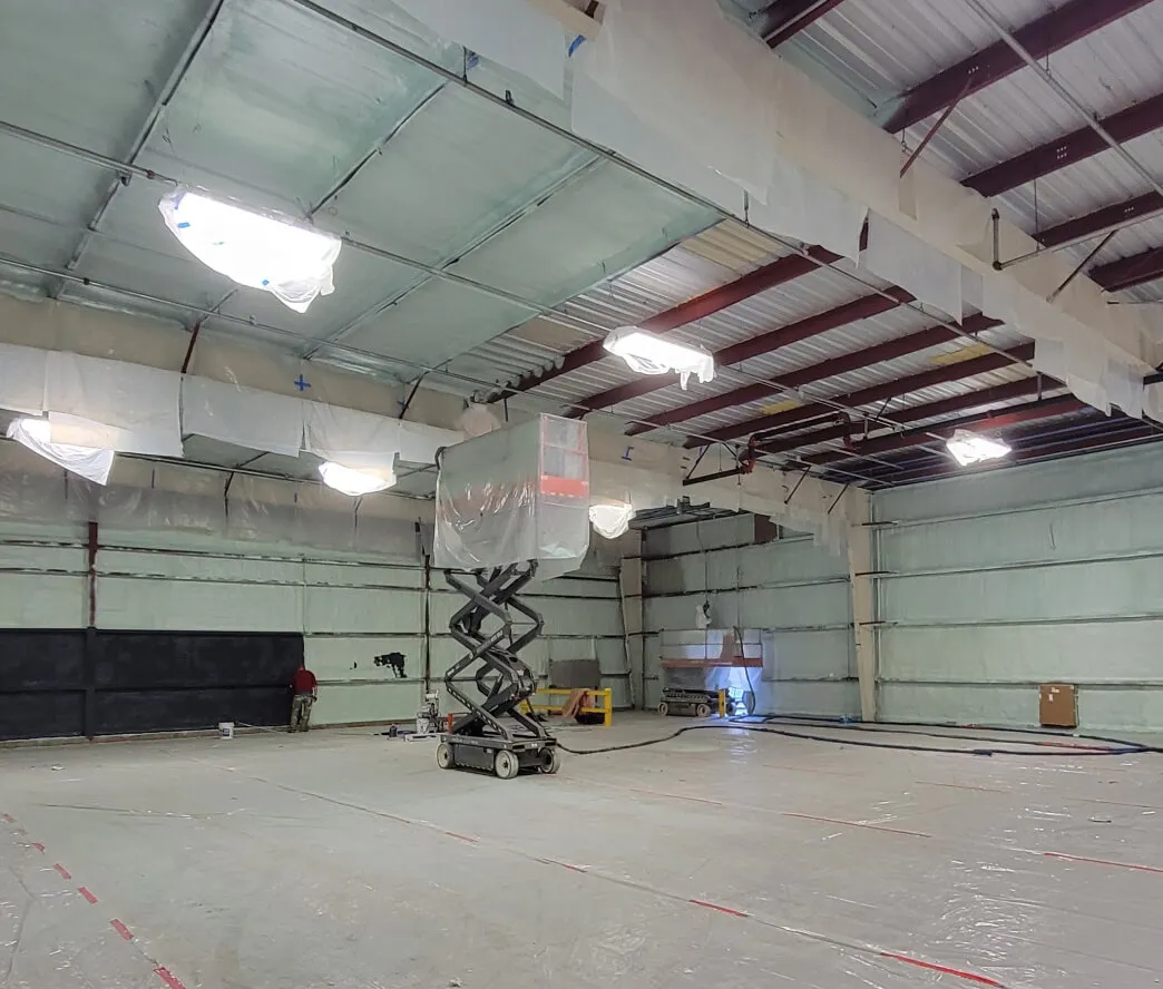 Commercial kitchen ceiling insulated with spray foam