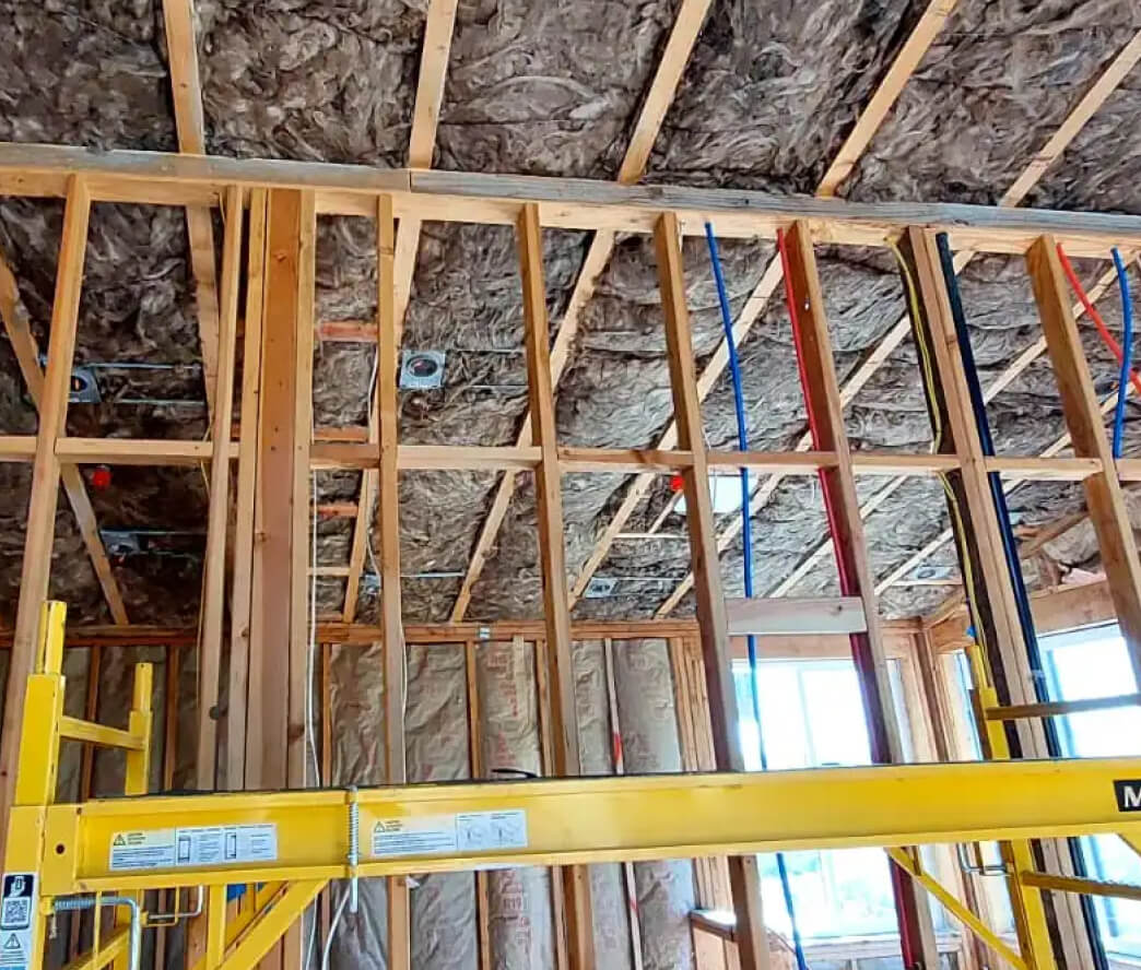 Soundproofing insulation installed between floors of a condo