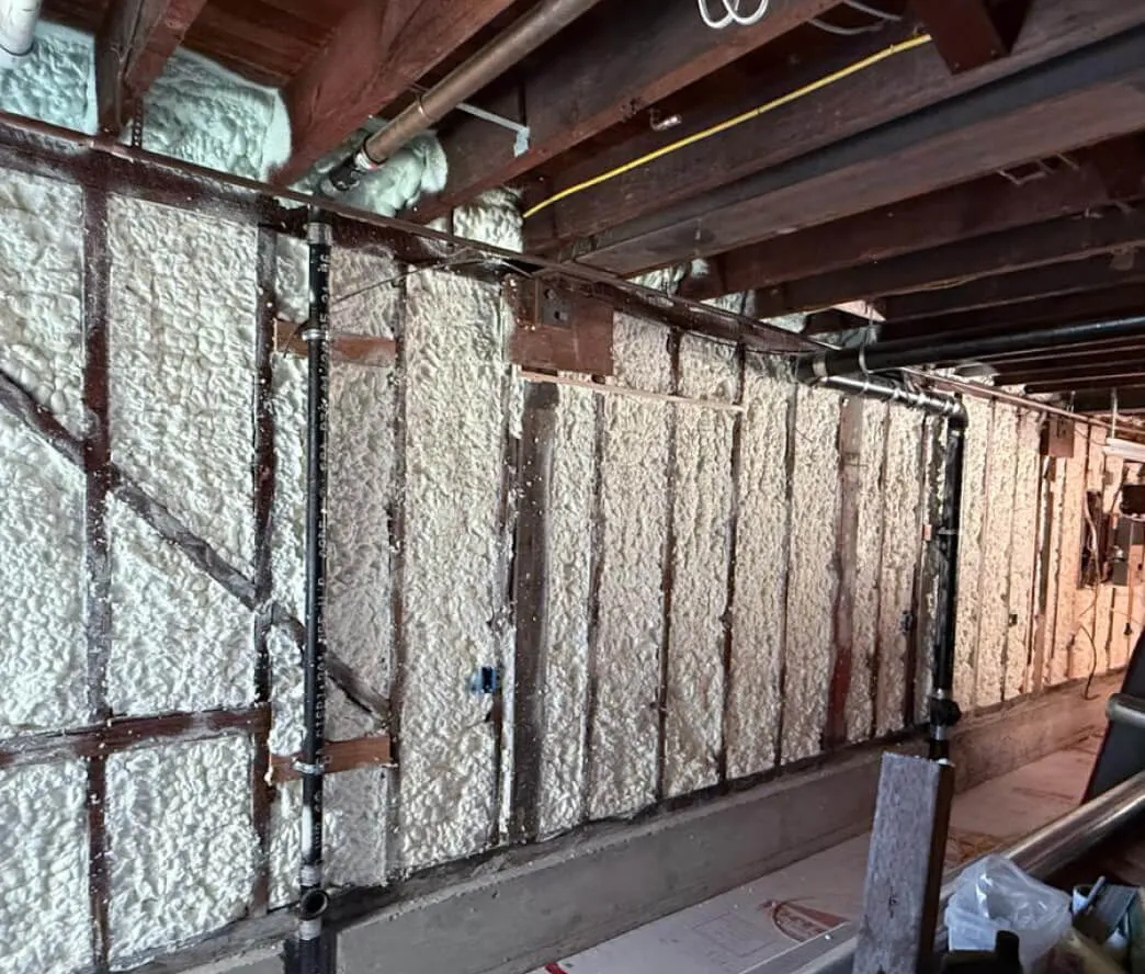 Spray foam insulation in exterior wall cavities of a Bay Area remodel