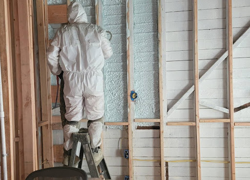 Professional application of insulating spray foam in wall cavities