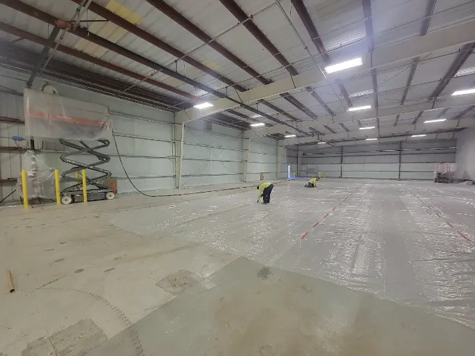 Warehouse undergoing insulation installation by USA Spray Me, highlighting their expertise in handling large-scale commercial projects.