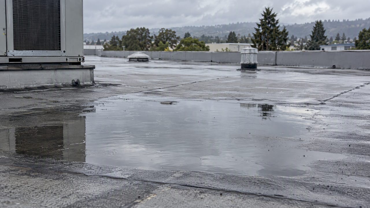 Standing water pooled on a commercial roof